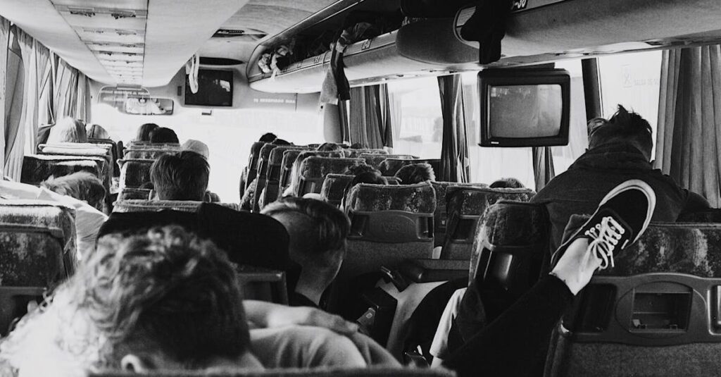 Grayscale Photo of People on a Bus