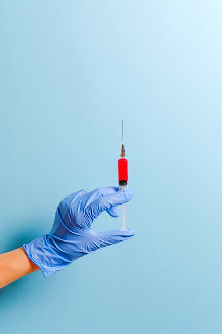 Person Holding Syringe