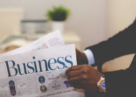 Person Holding White and Blue Business Paper