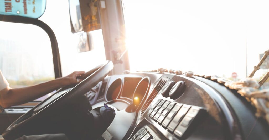 Person Hand On Steering Wheel