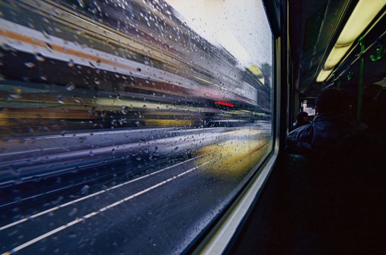 tram, bus, raindrops