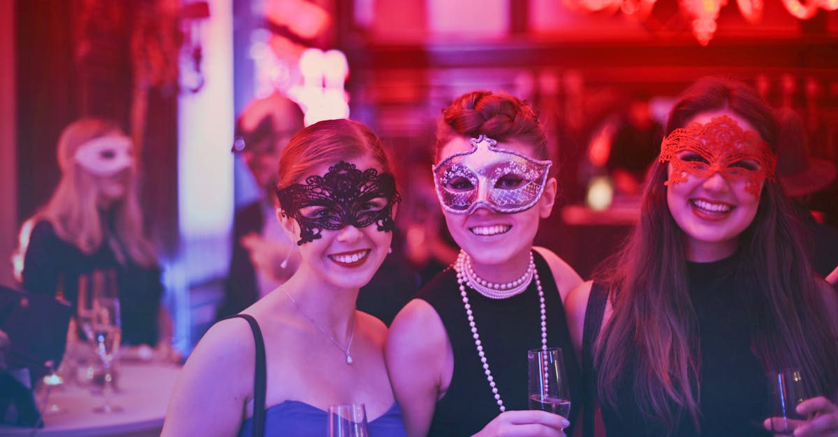 A vibrant masquerade party with happy guests wearing decorative masks and holding champagne glasses.