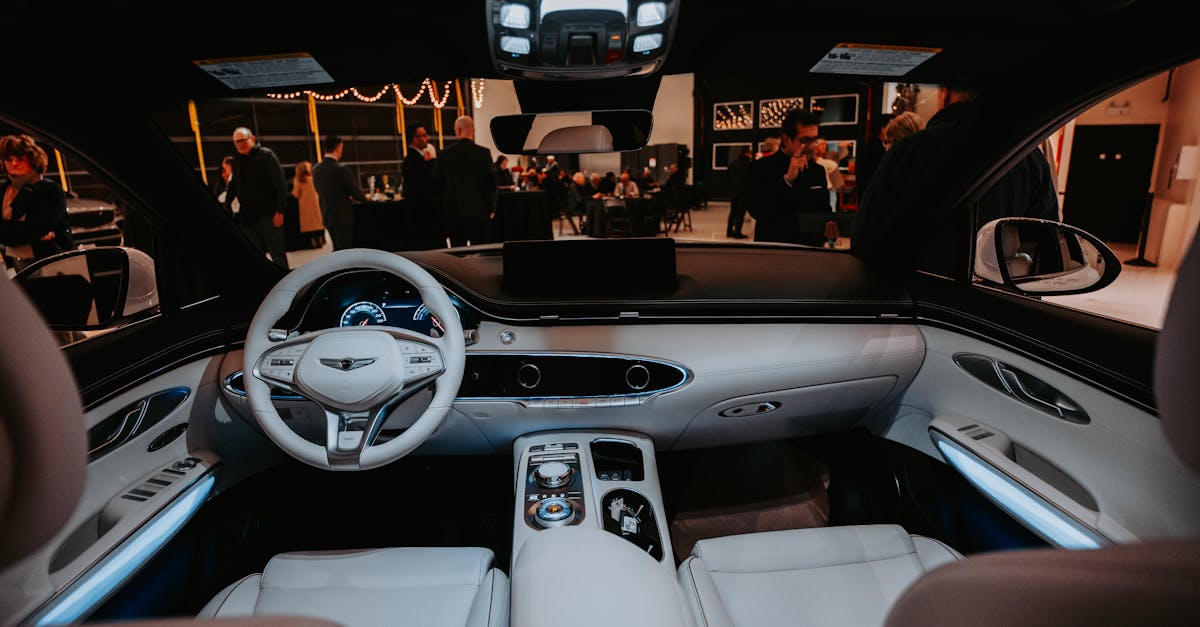 Elegant car interior view with people at a sophisticated event in the background.